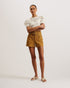 SELDA-Trousers-SELDA will be your summer staple. With its comfortable cotton blend, these casual denim shorts will flatter with their high waist, matching belt, and large pockets. They're the perfect blend of retro and modern. Denim shorts High waisted Belt with D-ring fastening Cotton blend Large front patch pockets Button and zip fly fastening Belt loops Stephanie is 5'8.5" / 1.74m and wears Brown in a Ted size 1- Ted Baker Romania